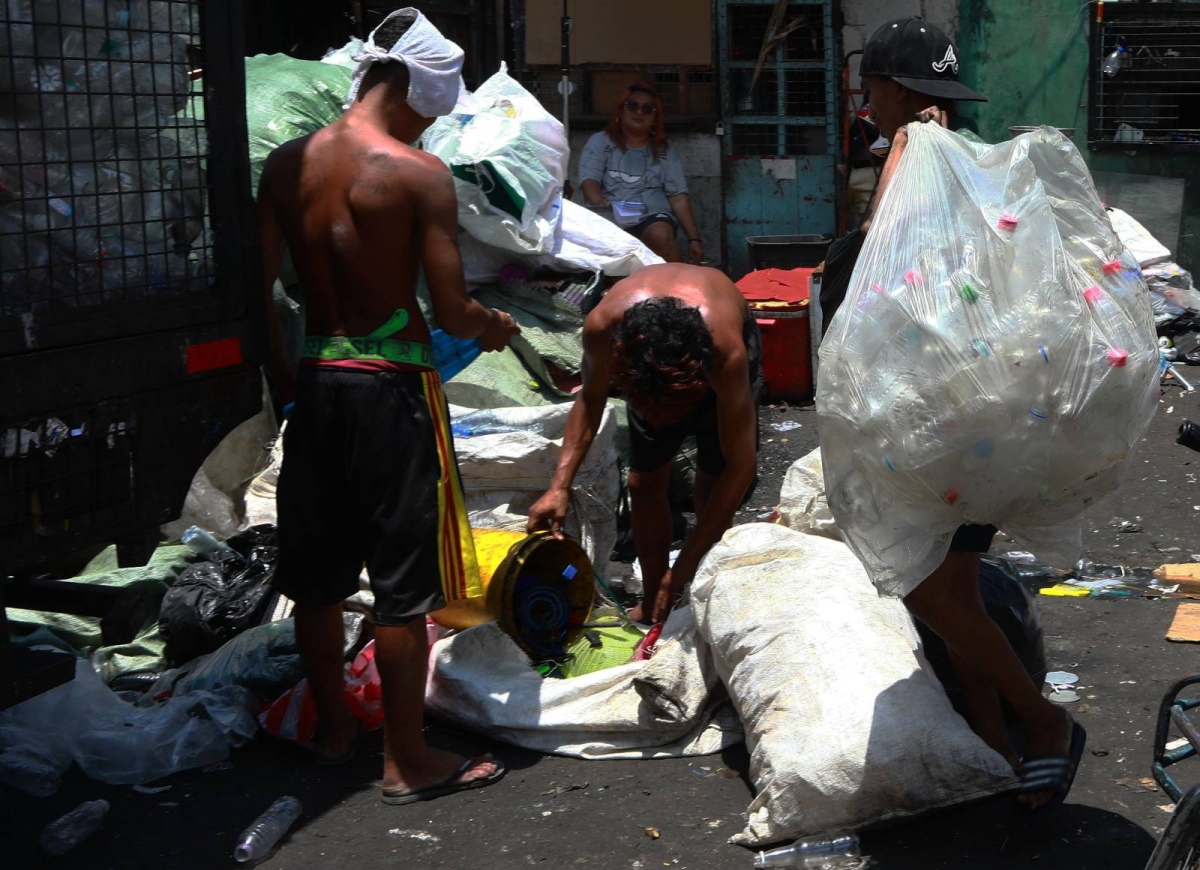 Workers segregate recyclable materials at a junk shop in Manila as the country marked World Earth Day on Monday, April 22, 2024. PHOTOS BY MIKE ALQUINTO

